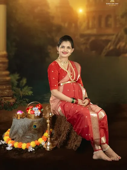 Embracing tradition with grace and beauty. This is a classic studio portrait of a mother-to-be in a traditional Maharashtrian-style saree, showcasing the timeless elegance of our cultural heritage.