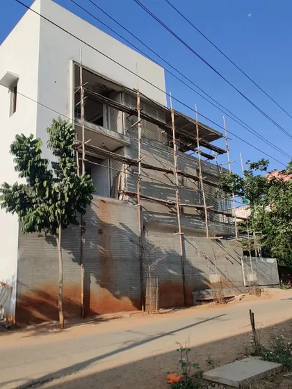 The house under construction, with scaffolding still covering parts of the facade.