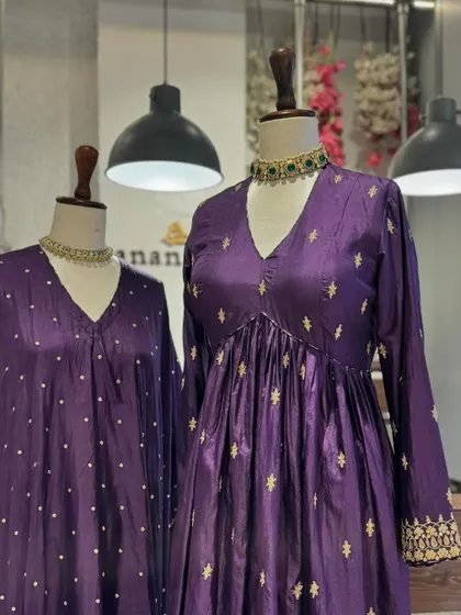 The rich jewel tone of purple is always a royal choice. These suits feature delicate embroidery, making them a sophisticated option for an evening celebration.