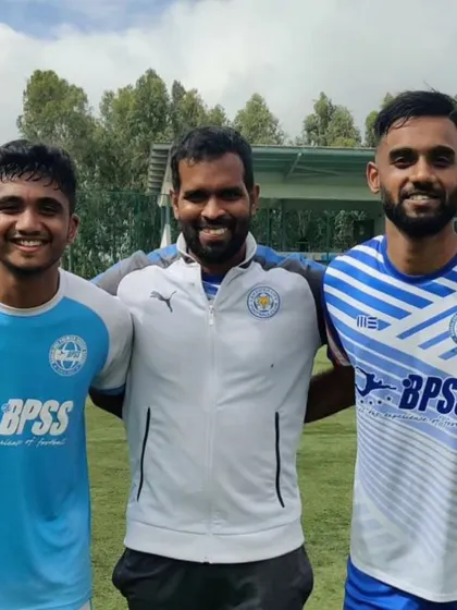 A coach with two of his players. I take great pride in the personal development of each individual in my academy.