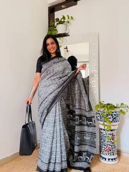 A grey and black printed art silk saree from Amazon that is perfect for the office. It's a sophisticated and modern print that looks very professional.