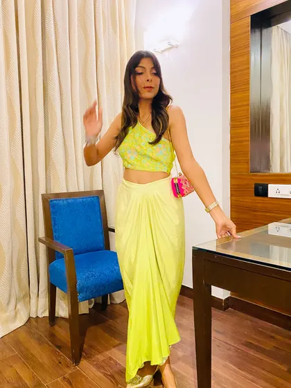 A candid photo showing the movement of the draped skirt. I help clients find outfits that are not only stylish but also comfortable to move and dance in.