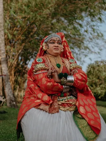 A traditional Kathakali performer adds a touch of local culture to a destination wedding in Kerala. I can help incorporate local elements to make your wedding unique.