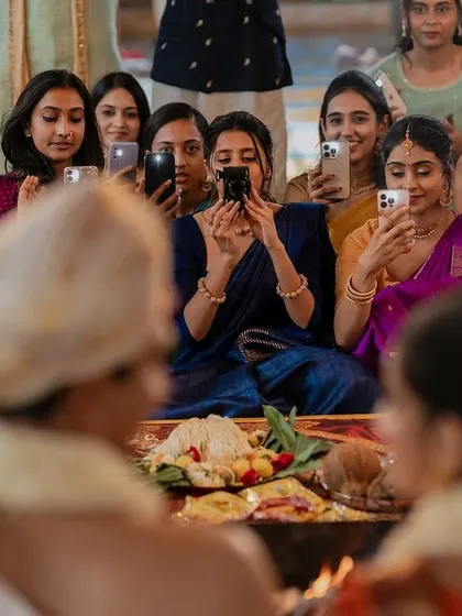 A modern twist on a traditional scene. While the ceremony unfolds, the guests capture their own memories, and we capture them, telling a multi-layered story.