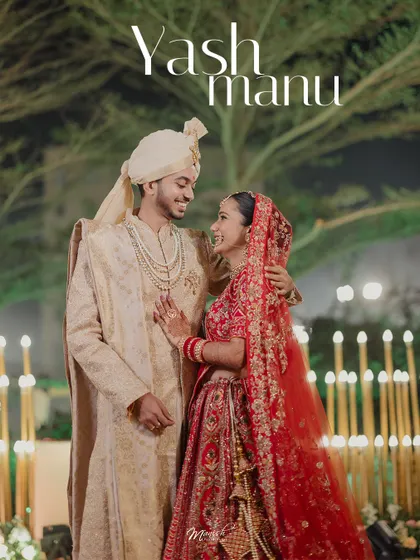 A beautiful night-time portrait of the Gujarati bride and groom, surrounded by the warm glow of candles, their smiles lighting up the frame.