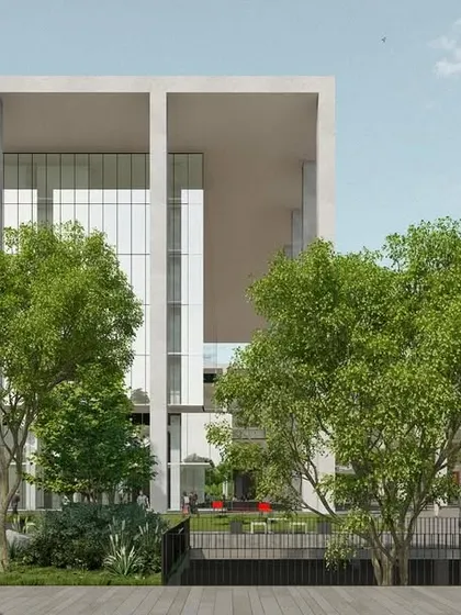 This perspective of the Telangana High Court shows the main courtyard, designed as a green lung for the complex. The architecture provides a monumental frame, but the human-scaled landscape with its trees and pathways makes the space feel open and accessible.
