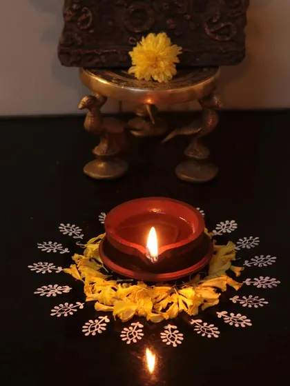 Happy Diwali from our family to yours. A simple diya, surrounded by a hand-block-printed rangoli, brings warmth and light to our studio.
