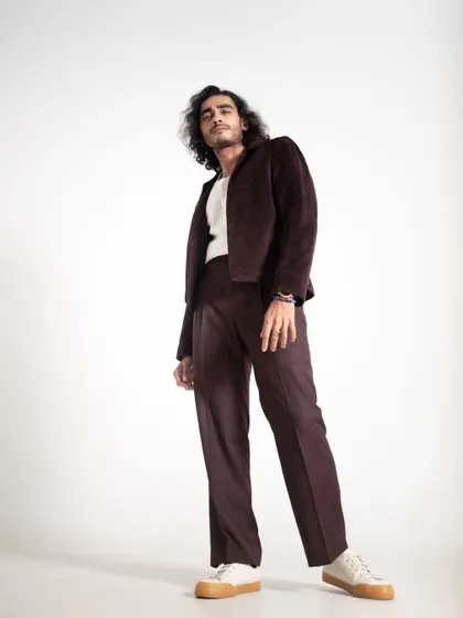 A low-angle shot that makes the outfit appear more powerful and statuesque.