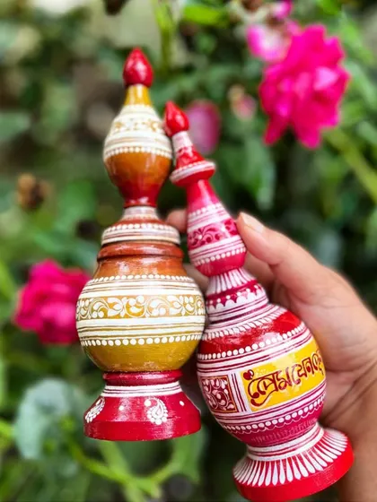 Two distinct styles of custom gachkouto, each hand-painted with intricate designs. We can match the design to your wedding theme or create something completely new for you.