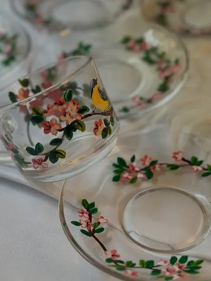 Your daily chai deserves a beautiful cup. I painted these delicate glass cups and saucers with a cherry blossom and bird design, perfect for making your tea time a little more special.