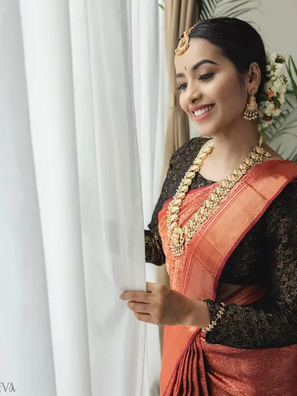 A happy, natural shot by the window. This shows how the makeup looks beautiful in soft, natural lighting, which is perfect for lifestyle-oriented campaigns.