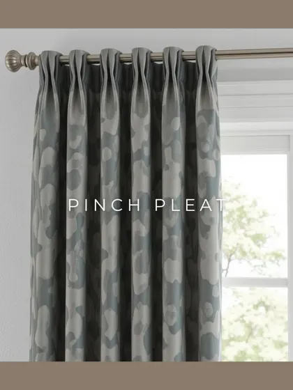 Pinch pleat curtains offer a classic, tailored look. The fabric is gathered into tight, uniform folds, creating a formal and elegant drape that works beautifully in traditional or transitional interiors.