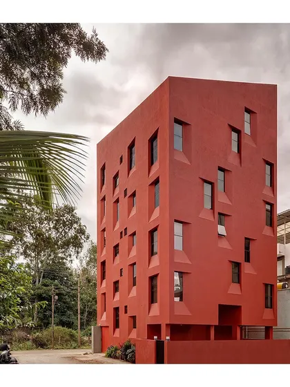 Another view of the "Stacked Student Housing" project, highlighting the deep recesses of the windows. These recesses provide shade and privacy for the students living inside.
