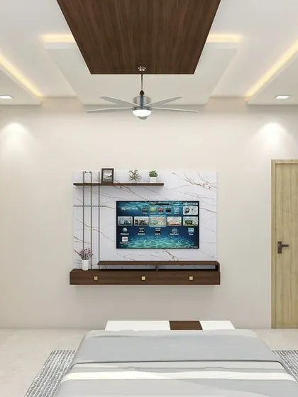 This image provides a clear view of the bedroom's layout, including the floating TV console and the full-height wardrobe. The design prioritizes clean lines and uncluttered surfaces for a modern and spacious feel.