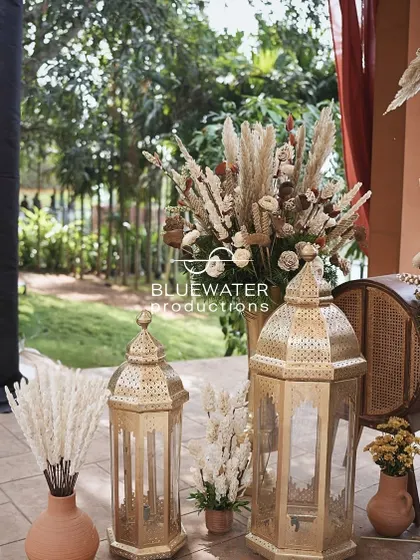 Rustic details for a Souk-themed Mehendi, including terracotta vases, pampas grass, and ornate brass lanterns.