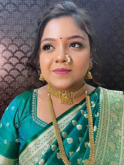 A portrait of the bride looking radiant and happy. The subtle glam makeup enhances her features without overpowering her, creating a look of pure elegance.