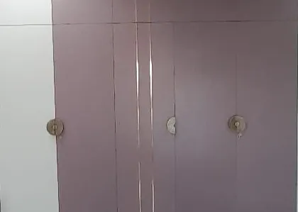 A successfully handed-over project featuring a modern wardrobe with unique circular handles. This image represents our promise of delivering beautiful, functional spaces built in our own factory.