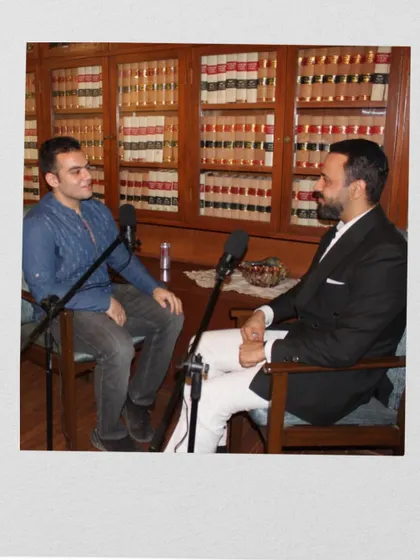 A snapshot from a podcast recording session, where I was decoding the intricate process of how lawyers read and interpret briefs. The library of law books in the background sets the perfect scene.