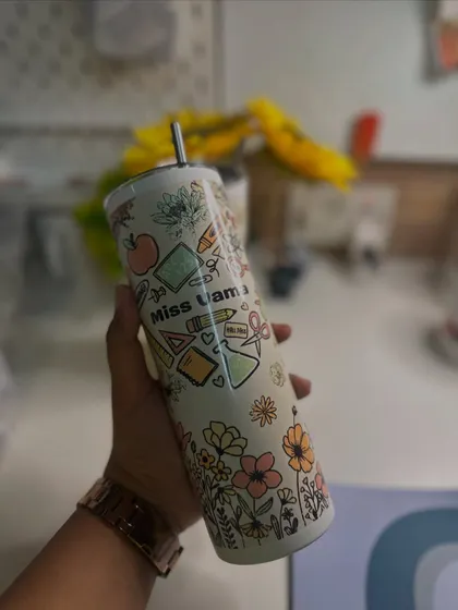 A close-up of one of my popular Teacher's Day gift items, a beautifully designed sipper tumbler with school-themed illustrations.