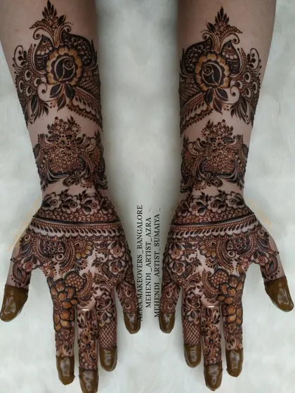 An elegant bridal design featuring peacock and floral motifs, with beautiful shading to create depth and dimension.
