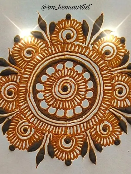 A classic floral mandala design, built with layers of petals and swirls radiating from a central point. This is a foundational design in mehendi art that I love teaching to my students.