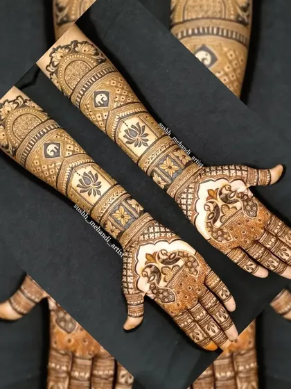 A creative layout showing a full bridal design. This pattern has bands of elephants and lotus flowers, with peacocks on the palm.