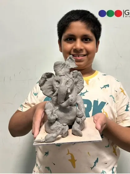 Look at the focus and pride on this young boy's face. Each student leaves our workshop with their own handmade, eco-friendly Ganpati.