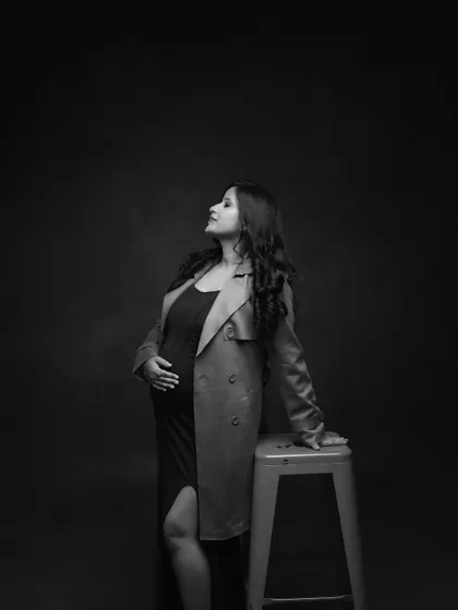 A dramatic and thoughtful pose in black and white. The upward gaze and the strong lighting create a powerful and contemplative mood.