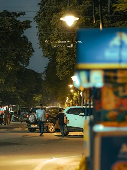 A view of a busy street through a gap in a vendor's stall. Using foreground elements to frame a scene is a technique I use to add depth and a sense of discovery.
