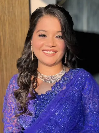 A close-up of the Bollywood-inspired look. The makeup features a soft, neutral palette with defined eyes and a natural lip, proving that you can achieve a cinematic feel with understated and elegant glam.