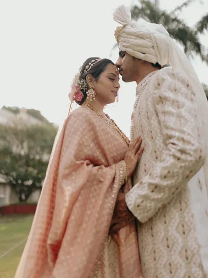 A quiet, forehead-kiss moment between Apurva and Hemant. This classic pose is timeless and always conveys a sense of love, protection, and tenderness.