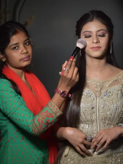 Practice makes perfect. This student is working on a subtle party makeup look, learning how to blend eyeshadow and apply a base for a flawless finish under different lighting conditions.