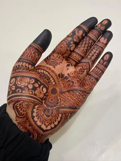 A close-up of a beautiful, dark henna stain, showing how the fine lines and details have developed into a rich color.