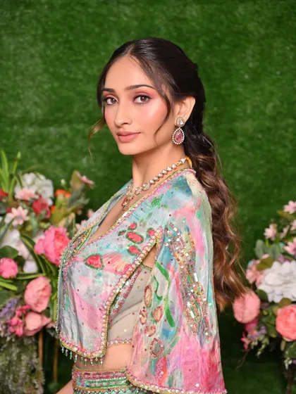This shot captures the complete hairstyle and makeup, showing how to create a cohesive and beautiful look for pre-wedding festivities.