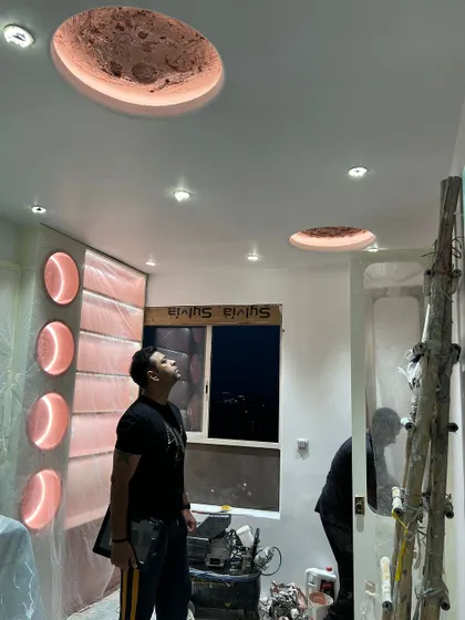 A wider shot of the kid's room ceiling, showing how the dual moon lights complement each other.