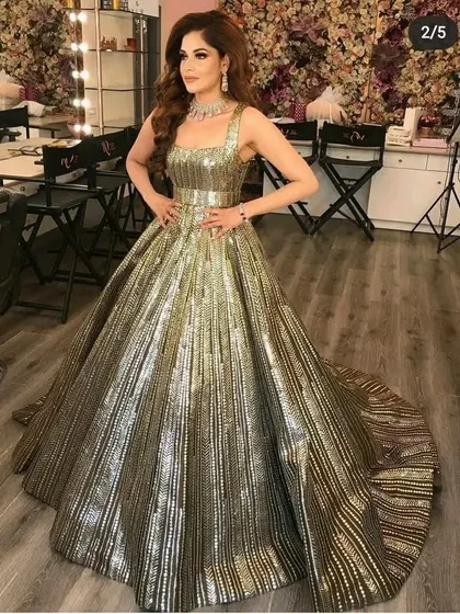 This metallic, structured ballgown is pure drama and high fashion. It's for the bride who wants a truly unique and unforgettable reception look.