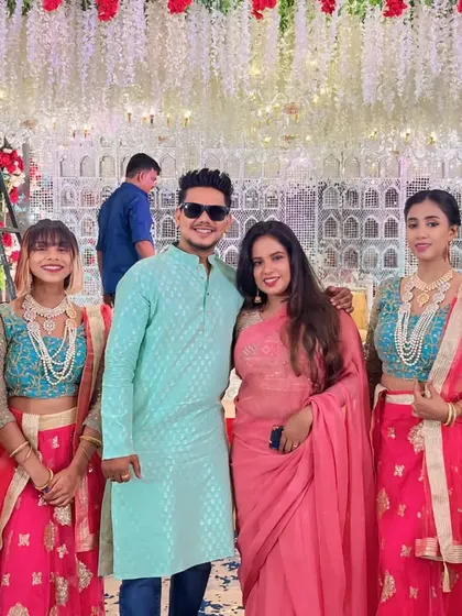 Our team of professional dancers is ready to make your entry grand. Here we are, posing with the happy couple and our dancers in coordinated outfits before the start of the event.