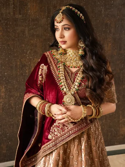 A bride wrapped in stories. This look is soft, distant, and dreamy, with makeup that enhances her features without overpowering her natural beauty.