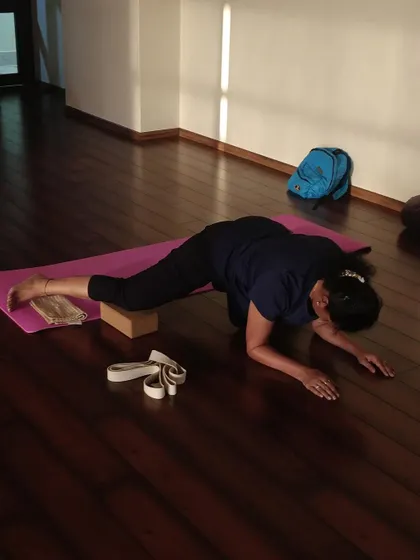 A yoga block and strap are excellent tools for releasing tight hips and hamstrings, making poses like Lizard Pose more accessible.