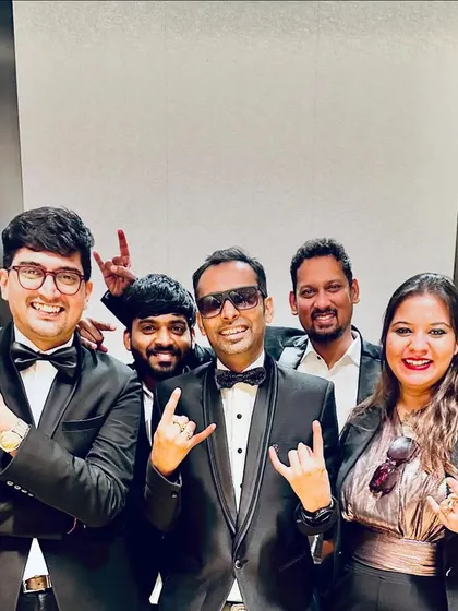 A happy group shot after a successful corporate gig. The smiles say it all; we love what we do and we love working together.
