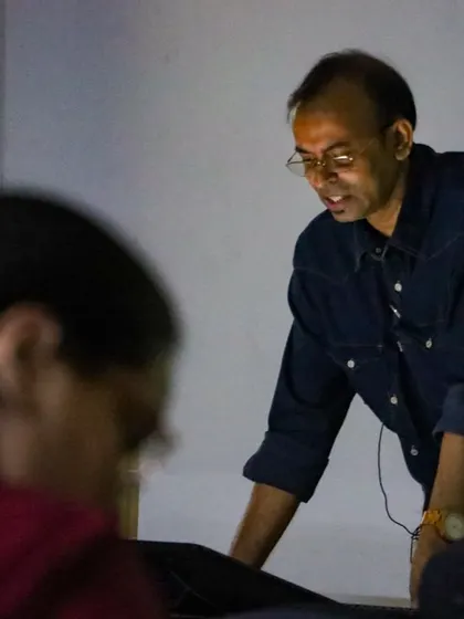 Interacting directly with a student and looking at their work during the IIIT Delhi workshop. I believe in giving personal, honest feedback to help each artist improve their specific skills.