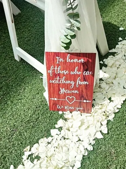 We believe in personal touches that hold deep meaning. This custom sign was created to honor loved ones watching from heaven, adding a heartfelt and emotional element to the wedding day.