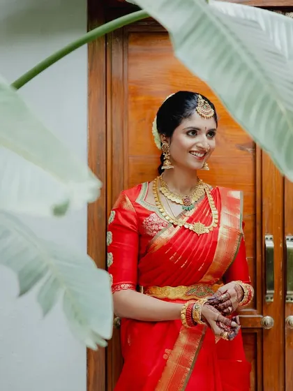 A smiling shot of Rishika. The makeup is designed to look fresh and natural in daylight.