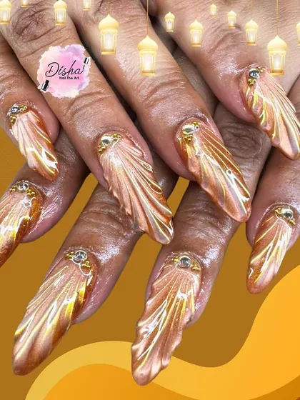 Golden glam with a touch of royalty. A closer look at the stunning 3D golden wing design, featuring a metallic chrome finish and jewel accents.