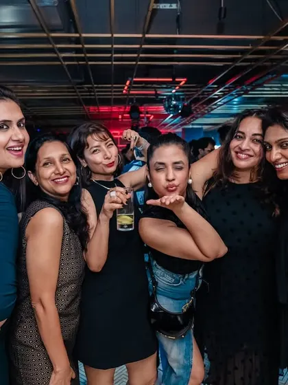 A group of friends having a great time at my Bollywood night. It's all about creating a space for people to celebrate together.