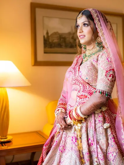 Another beautiful shot of Shikha on her wedding day. Her makeup is perfectly balanced, with soft eyes and a natural lip, letting her bridal glow shine through.