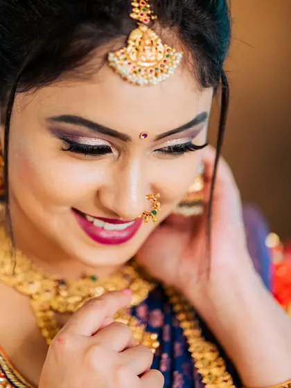 A close-up candid smile from a styled bridal shoot, showing our skill in capturing natural expressions even in a studio setting.