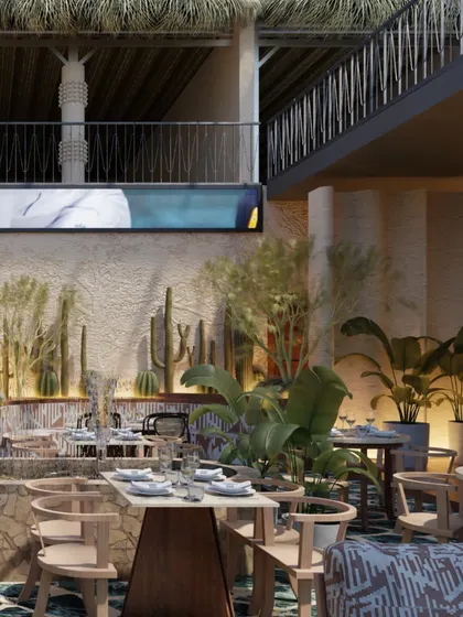Another view of the multi-level dining area, showing how the different zones are connected. The design encourages exploration, with each corner offering a new perspective and experience.