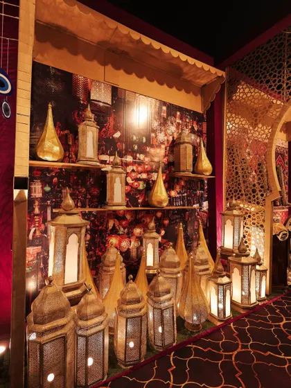 The lamp market stall, designed to look like a shop in a souk. The warm light from the lanterns created an inviting and enchanting atmosphere.