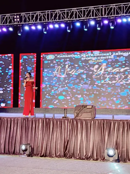 Our event productions often feature a variety of performers. Here, an emcee engages the crowd at the Karnataka State Cricket Association's New Year 2023 event, which we helped produce.